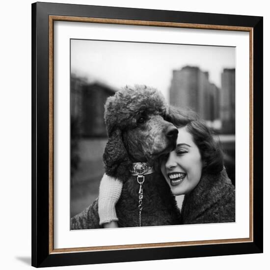 Woman Profiling a Big Smile While Adoring Her Poodle Wearing Large Swiss Watch on Dog Collar-Yale Joel-Framed Photographic Print