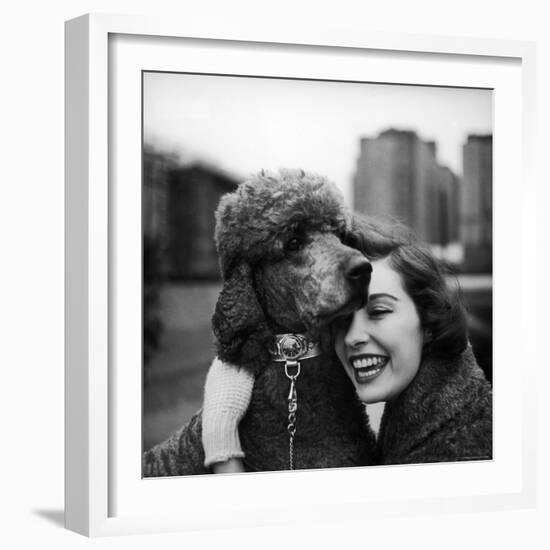 Woman Profiling a Big Smile While Adoring Her Poodle Wearing Large Swiss Watch on Dog Collar-Yale Joel-Framed Photographic Print