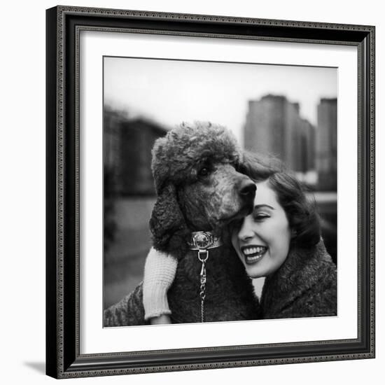 Woman Profiling a Big Smile While Adoring Her Poodle Wearing Large Swiss Watch on Dog Collar-Yale Joel-Framed Photographic Print