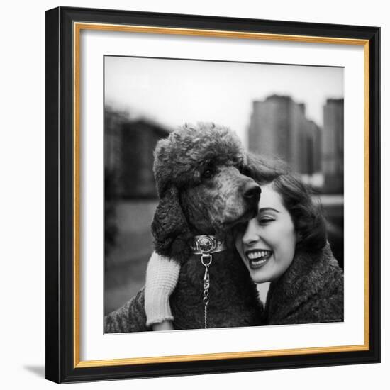 Woman Profiling a Big Smile While Adoring Her Poodle Wearing Large Swiss Watch on Dog Collar-Yale Joel-Framed Photographic Print