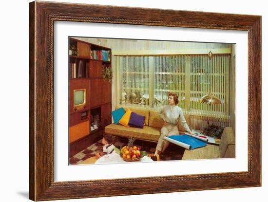 Woman Reading Plans in Living Room, Retro-null-Framed Art Print