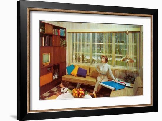 Woman Reading Plans in Living Room, Retro-null-Framed Art Print