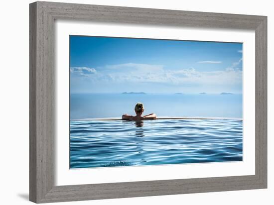 Woman Relaxing in Infinity Swimming Pool on Vacation-Splendens-Framed Photographic Print