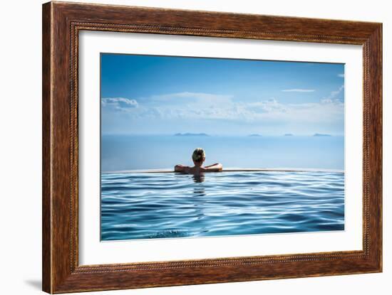 Woman Relaxing in Infinity Swimming Pool on Vacation-Splendens-Framed Photographic Print