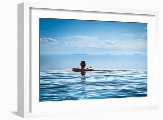 Woman Relaxing in Infinity Swimming Pool on Vacation-Splendens-Framed Photographic Print