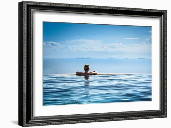 Woman Relaxing in Infinity Swimming Pool on Vacation-Splendens-Framed Photographic Print