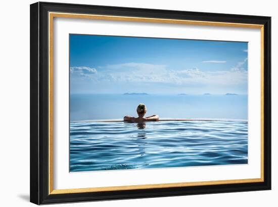 Woman Relaxing in Infinity Swimming Pool on Vacation-Splendens-Framed Photographic Print