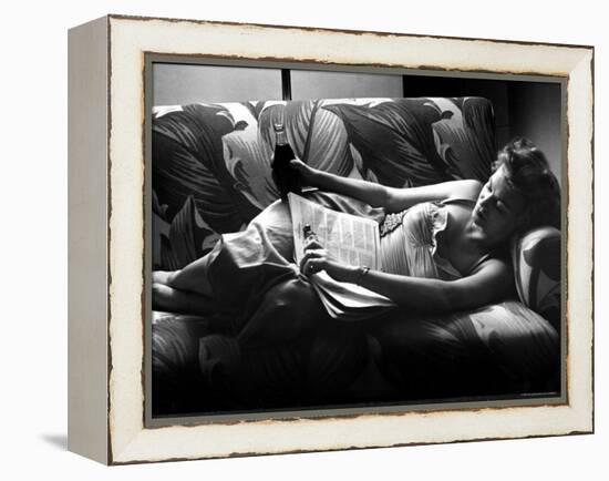 Woman Relaxing on Sofa, Reading and Drinking a Coke-Nina Leen-Framed Premier Image Canvas
