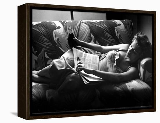 Woman Relaxing on Sofa, Reading and Drinking a Coke-Nina Leen-Framed Premier Image Canvas