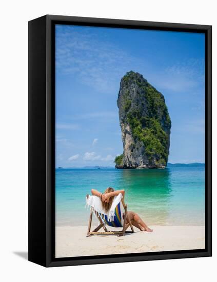Woman Relaxing on the Beach on a Sunbed in Thailand-Netfalls-Framed Premier Image Canvas