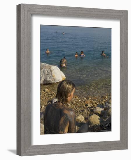 Woman's Back Covered with Mud and People Floating in the Sea in Background, Dead Sea, Israel-Eitan Simanor-Framed Photographic Print