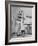 Woman Scrubbing Kitchen Floor with Brushes Attached to Her Feet-Allan Grant-Framed Photographic Print