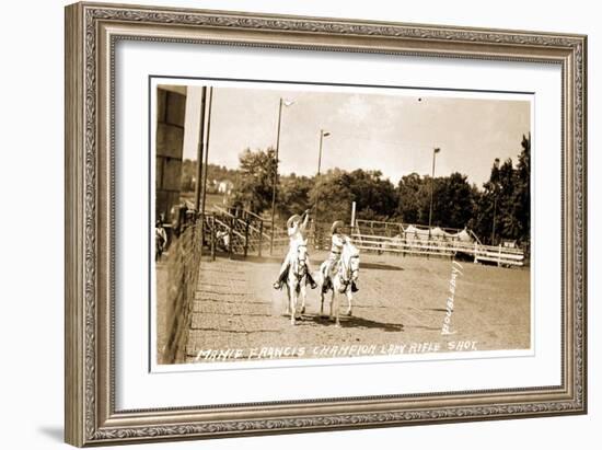 Woman Shooting Rifle from Horse-null-Framed Art Print