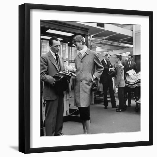 Woman Shopping in Brooks Brothers Wearing Men's Tweed Topcoat-Nina Leen-Framed Photographic Print