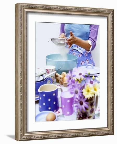 Woman Sieving Flour into a Bowl, Crockery & Eggs in Front-Linda Burgess-Framed Photographic Print