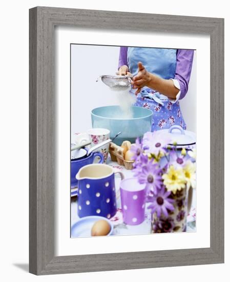 Woman Sieving Flour into a Bowl, Crockery & Eggs in Front-Linda Burgess-Framed Photographic Print