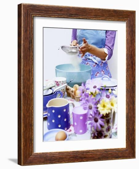 Woman Sieving Flour into a Bowl, Crockery & Eggs in Front-Linda Burgess-Framed Photographic Print