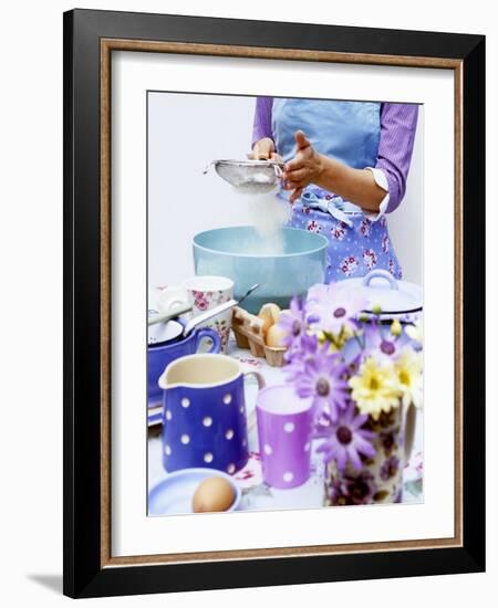 Woman Sieving Flour into a Bowl, Crockery & Eggs in Front-Linda Burgess-Framed Photographic Print