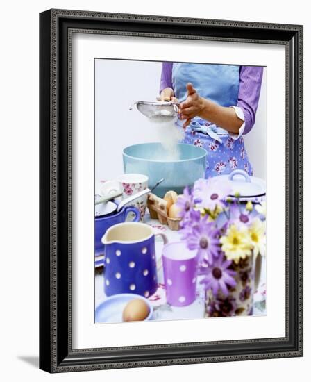 Woman Sieving Flour into a Bowl, Crockery & Eggs in Front-Linda Burgess-Framed Photographic Print