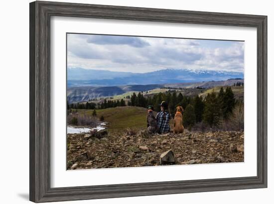 Woman Sits Next To Her Two Dogs Looking Out Into Idaho's Mountainous Landscape-Hannah Dewey-Framed Photographic Print