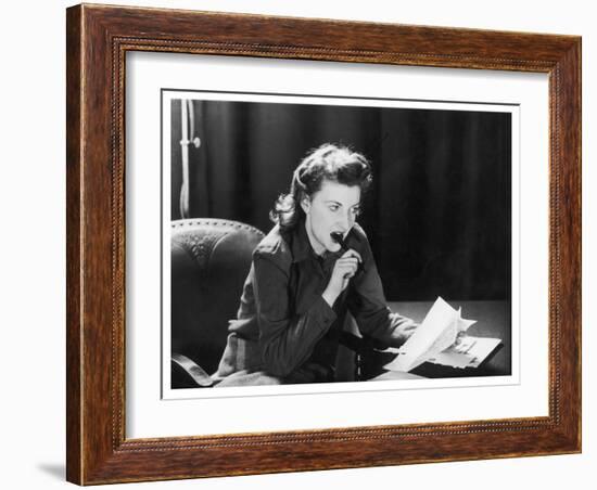 Woman Sits with Her Pen in Her Mouth Whilst Thinking About What She Should Write in Her Letter-null-Framed Art Print