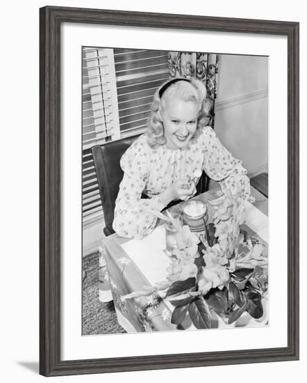 Woman Sitting at a Breakfast Table-null-Framed Photo