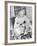 Woman Sitting at a Breakfast Table-null-Framed Photo