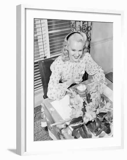 Woman Sitting at a Breakfast Table-null-Framed Photo