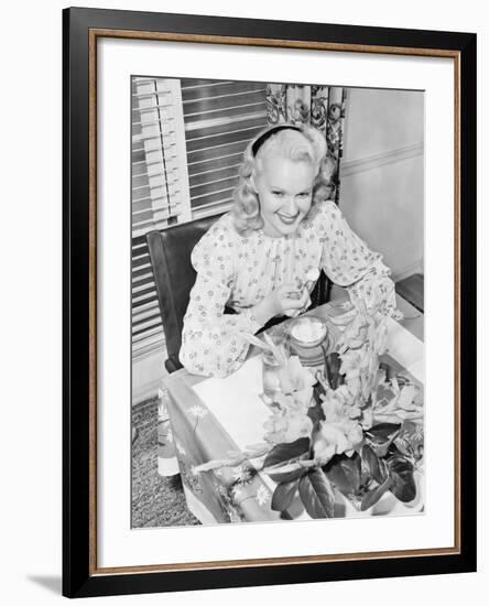 Woman Sitting at a Breakfast Table-null-Framed Photo