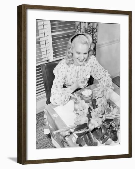 Woman Sitting at a Breakfast Table-null-Framed Photo