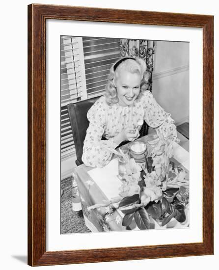 Woman Sitting at a Breakfast Table-null-Framed Photo