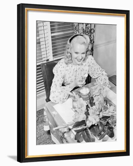 Woman Sitting at a Breakfast Table-null-Framed Photo