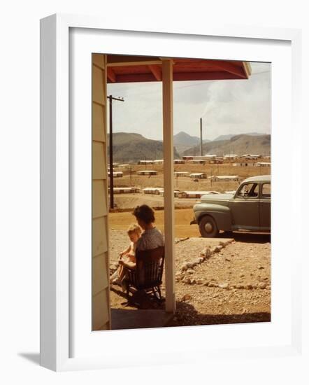 Woman Sitting in Rocking Chair on Veranda Playing with Baby on Her Lap-Andreas Feininger-Framed Photographic Print