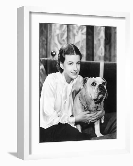 Woman Sitting on a Sofa Holding Her Bulldog-null-Framed Photo