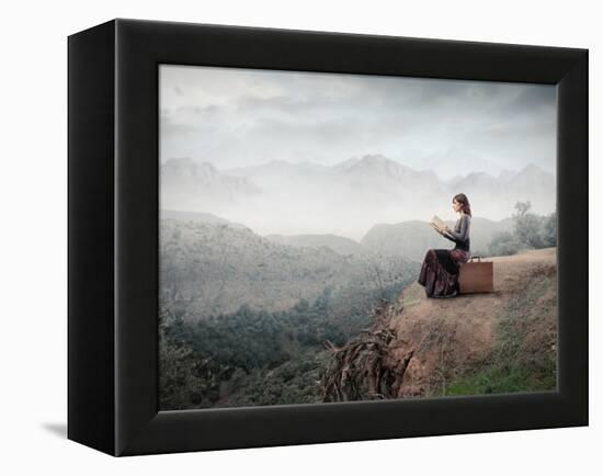 Woman Sitting On A Suitcase And Reading A Book With Landscape On The Background-olly2-Framed Stretched Canvas