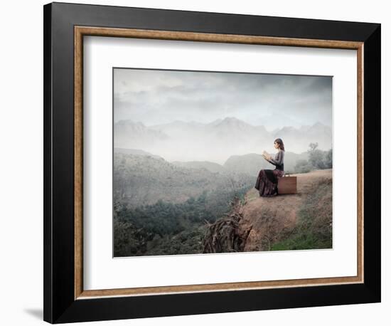 Woman Sitting On A Suitcase And Reading A Book With Landscape On The Background-olly2-Framed Premium Giclee Print