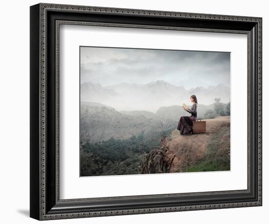 Woman Sitting On A Suitcase And Reading A Book With Landscape On The Background-olly2-Framed Premium Giclee Print