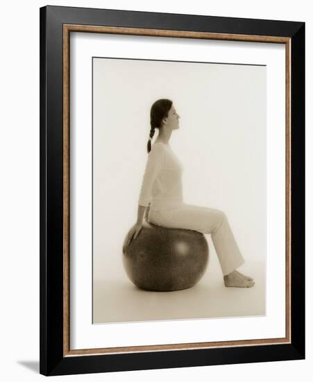 Woman Sitting on Exercise Ball-Cristina-Framed Photographic Print