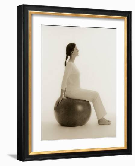 Woman Sitting on Exercise Ball-Cristina-Framed Photographic Print