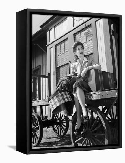 Woman Sitting on Luggage Trolley-Philip Gendreau-Framed Premier Image Canvas