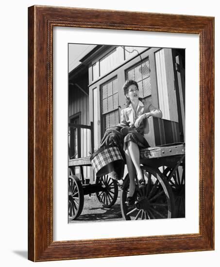 Woman Sitting on Luggage Trolley-Philip Gendreau-Framed Photographic Print