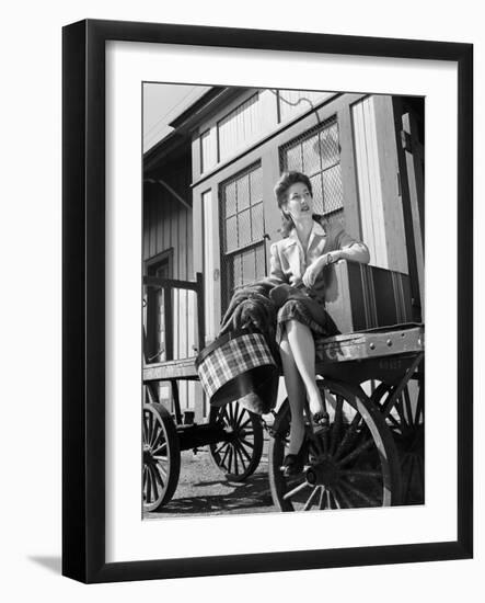 Woman Sitting on Luggage Trolley-Philip Gendreau-Framed Photographic Print