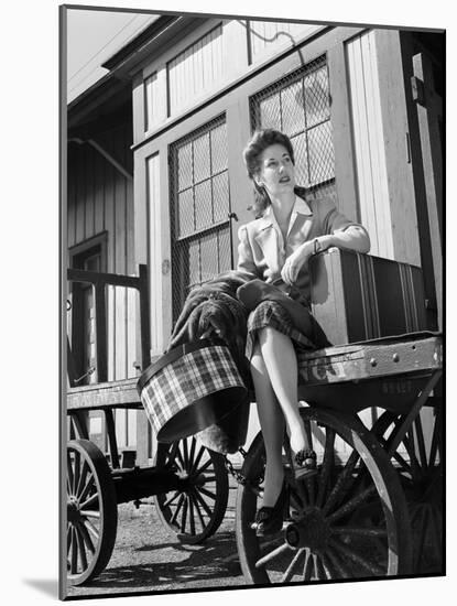 Woman Sitting on Luggage Trolley-Philip Gendreau-Mounted Photographic Print