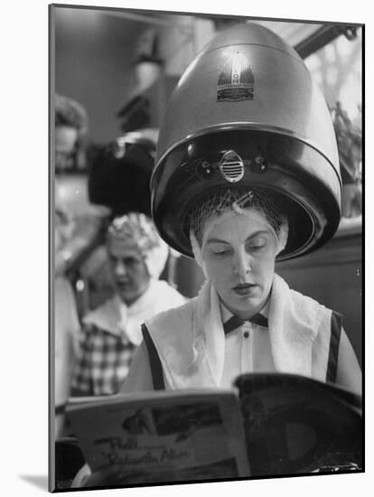 Woman Sitting under Hair Dryer Reading a Magazine-Gordon Parks-Mounted Photographic Print