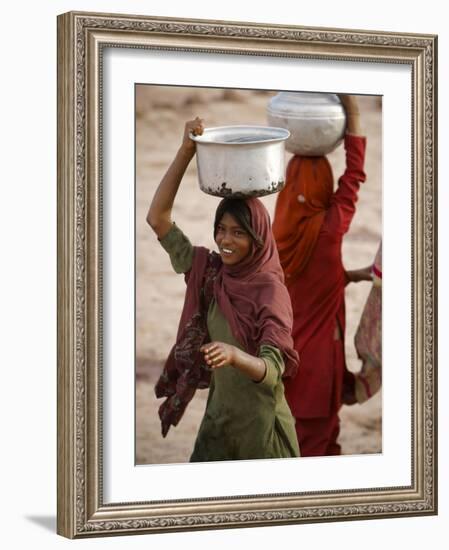 Woman Smiles after Collecting Drinking Water, on the Outskirts of Islamabad, Pakistan-null-Framed Photographic Print