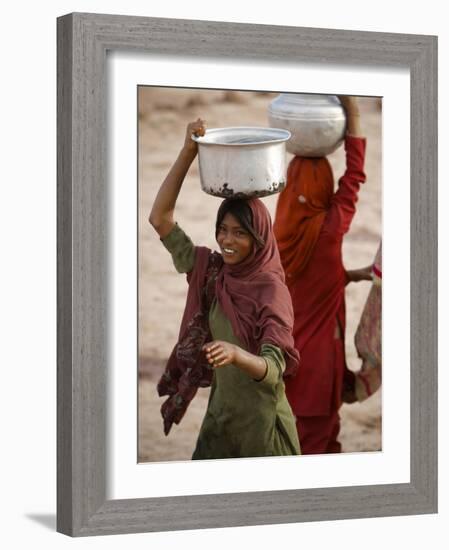 Woman Smiles after Collecting Drinking Water, on the Outskirts of Islamabad, Pakistan-null-Framed Photographic Print