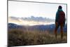 Woman Stands Looking Out Into Montana's Rocky Mountains With Her Hiking Backpack On-Hannah Dewey-Mounted Photographic Print