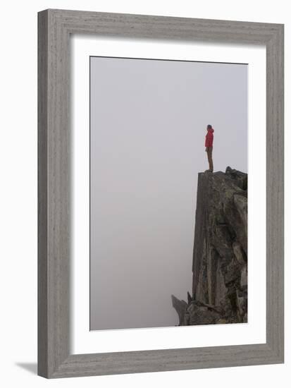 Woman Stands Looking Out Into The Fog On Top Of A Cliff In The North Cascades, Wa-Hannah Dewey-Framed Photographic Print