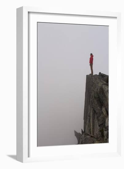 Woman Stands Looking Out Into The Fog On Top Of A Cliff In The North Cascades, Wa-Hannah Dewey-Framed Photographic Print