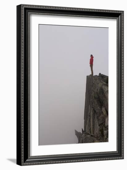 Woman Stands Looking Out Into The Fog On Top Of A Cliff In The North Cascades, Wa-Hannah Dewey-Framed Photographic Print